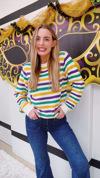 White Sweater with Purple, Green, and Gold Stripes